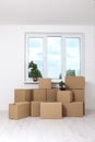 Moving into a new apartment. Move lots of cardboard boxes in an empty new apartment. Royalty Free Stock Photo