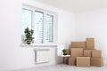 Moving into a new apartment. Move lots of cardboard boxes in an empty new apartment. Royalty Free Stock Photo