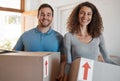 Moving, new home or portrait of happy couple with boxes in real estate, property or rental apartment. Woman, proud man Royalty Free Stock Photo