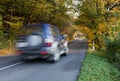 Moving off-road car on the asphalt highway Royalty Free Stock Photo