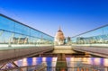 Moving people alonf Millennium Bridge in London. Night view of S Royalty Free Stock Photo