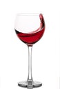 Moving red wine glass over a white background Royalty Free Stock Photo