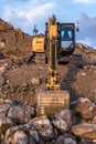 Moving rock and sand in a construction site.