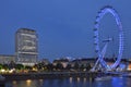 Moving / rotating London Eye in the night with surroundings Royalty Free Stock Photo