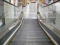 A moving shopping trolley escalator Royalty Free Stock Photo