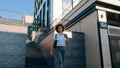 Moving shot happy confident African American business woman girl lady ethnic female businesswoman walking in city walk Royalty Free Stock Photo