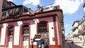 Moving sofa from the roof of the house in Havana Cuba