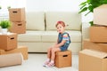 Moving to new apartment. happy child and cardboard box Royalty Free Stock Photo