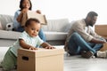 Happy African American family relocating to new apartment Royalty Free Stock Photo