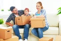 Moving to new home. Happy family with cardboard boxes Royalty Free Stock Photo