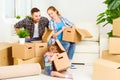 Moving to new home. Happy family with cardboard boxes Royalty Free Stock Photo