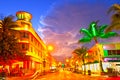 Moving traffic, Illuminated hotels and restaurants at sunset on Ocean Drive, Royalty Free Stock Photo