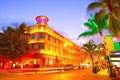 Moving traffic, Illuminated hotels and restaurants at sunset on Ocean Drive Royalty Free Stock Photo