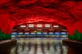 Moving train Stockholm metro or tunnelbana station Solna Centrum with fire like wall designs