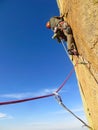motivate traditional rock climber working his way up a cliff Royalty Free Stock Photo