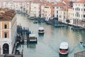 Moving vaporettos on the Grand Canal in Venice in the evening