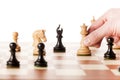 Moving white chess queen on a chessboard Royalty Free Stock Photo