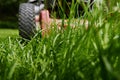 Mow lawn low angle of lawnmower cutting grass.