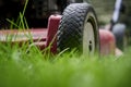 Mow lawn low angle of lawnmower cutting grass. Royalty Free Stock Photo