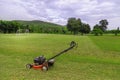 Mowing graass on the football field Royalty Free Stock Photo