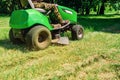 Mowing grass in the park. Lawn mower. Lawn care Royalty Free Stock Photo