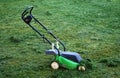 Mowing Lawn With Green Lawnmower