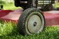 Mowing lawn. Low angle cutting grass Royalty Free Stock Photo