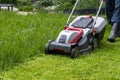 Mowing tall, dense grass with an electric lawn mower