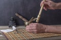 Moxibustion therapy - Traditional Chinese Medicine. Placement of the burning moxa stick on the arm. Royalty Free Stock Photo