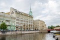 Moyka River with the Red Bridge and the department store Au Pont Rouge in Saint Petersburg, Russia Royalty Free Stock Photo