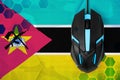 Mozambique flag and computer mouse. Concept of country representing e-sports team