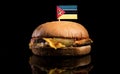 Mozambique flag on top of hamburger on black