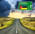 Mozambique road sign against clear blue sky Royalty Free Stock Photo