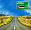 Mozambique road sign against clear blue sky Royalty Free Stock Photo