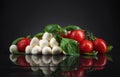 Mozarella with small tomatoes and basil . Royalty Free Stock Photo