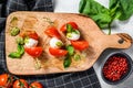 Mozzarella Cheese canape sandwiches on skewers, Caprese salad. gray background. top view Royalty Free Stock Photo