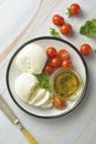 Mozzarella cheese and cherry tomatoes with spices. Homemade mozzarella cheese Royalty Free Stock Photo