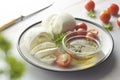 Mozzarella cheese and cherry tomatoes with spices. Homemade mozzarella cheese Royalty Free Stock Photo