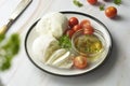 Mozzarella cheese and cherry tomatoes with spices. Homemade mozzarella cheese Royalty Free Stock Photo