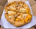 mozzarella cheese chicken pizza cut into 4 pieces in a cardboard box Royalty Free Stock Photo