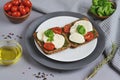 Mozzarella cheese with red tomatoes and basil leaves, pepper, olive oil Royalty Free Stock Photo