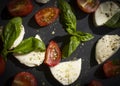 Mozzarella cheese, tomato, basil   healthy  salad  a dark background Royalty Free Stock Photo