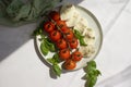 Mozzarella cheese, tomato, basil on a light background Royalty Free Stock Photo