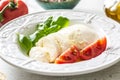 Mozzarella cheese tomatoes basil and olive oil. Caprese salad - italian or mediterranean meal or appetizer