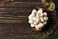 Mozzarella cheese in a wooden bowl with spices and butter on a wooden table Royalty Free Stock Photo