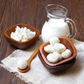 Mozzarella cheese in a wooden bowl on the table Royalty Free Stock Photo