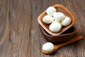 Mozzarella cheese in a wooden bowl on the table Royalty Free Stock Photo