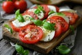 Mozzarella and tomato salad. Fresh italian caprese salad with mozzarella and tomatoes on wooden board