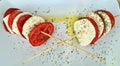 Mozzarella tomatoes pesto saune plate Royalty Free Stock Photo