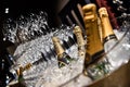 Moet & Chandon champagne tasting in event. Many glasses and bottles of champagne in to the ice with Moet & Chandon logo